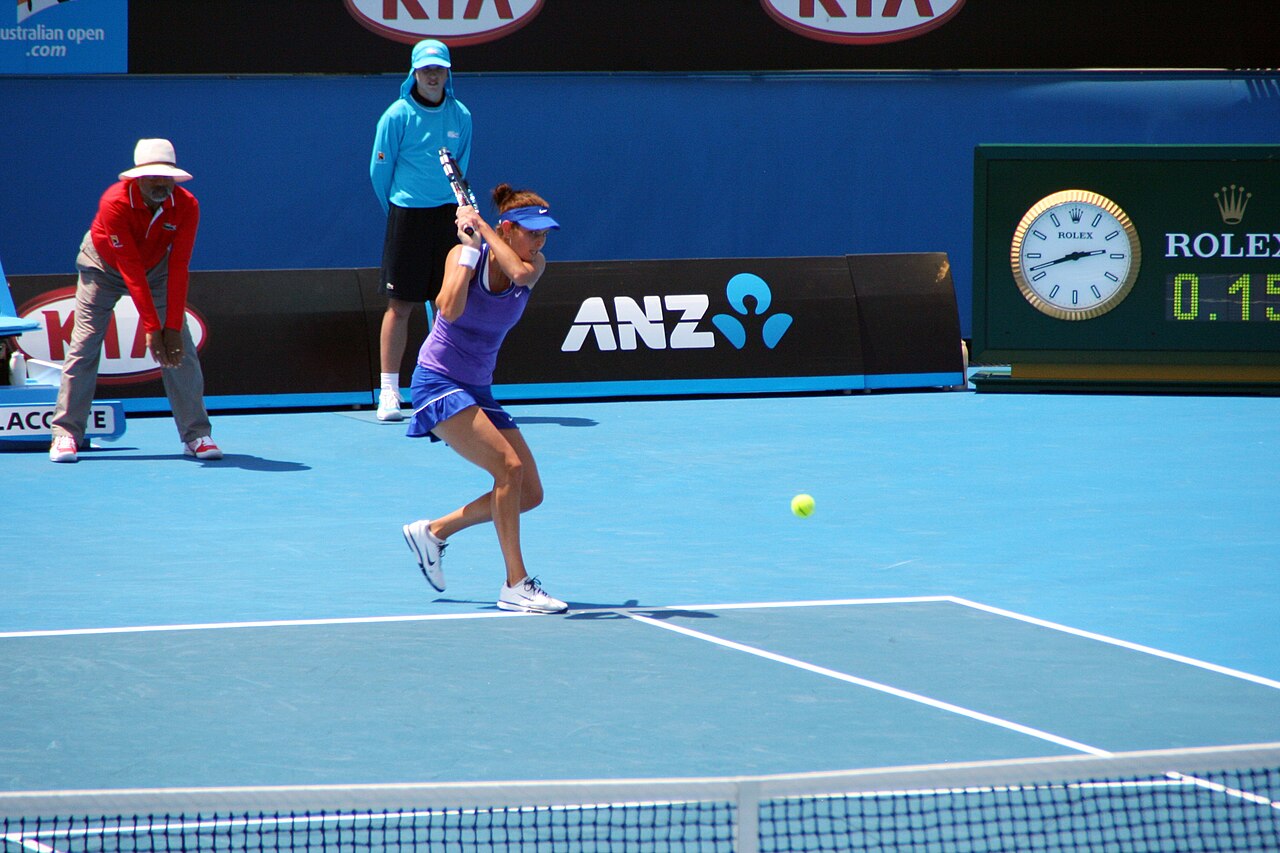 Tennis player competing on court